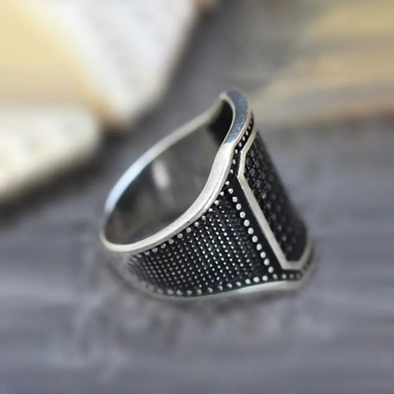 Black alloy ring with copper inlay around zircon stone, unisex design available sizes 7 to 13