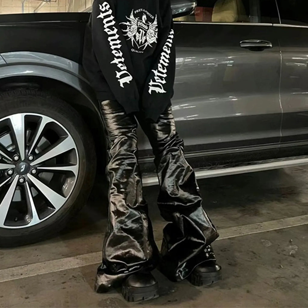 Black shiny patent leather skinny jeans with straight leg cut and mid waist design
