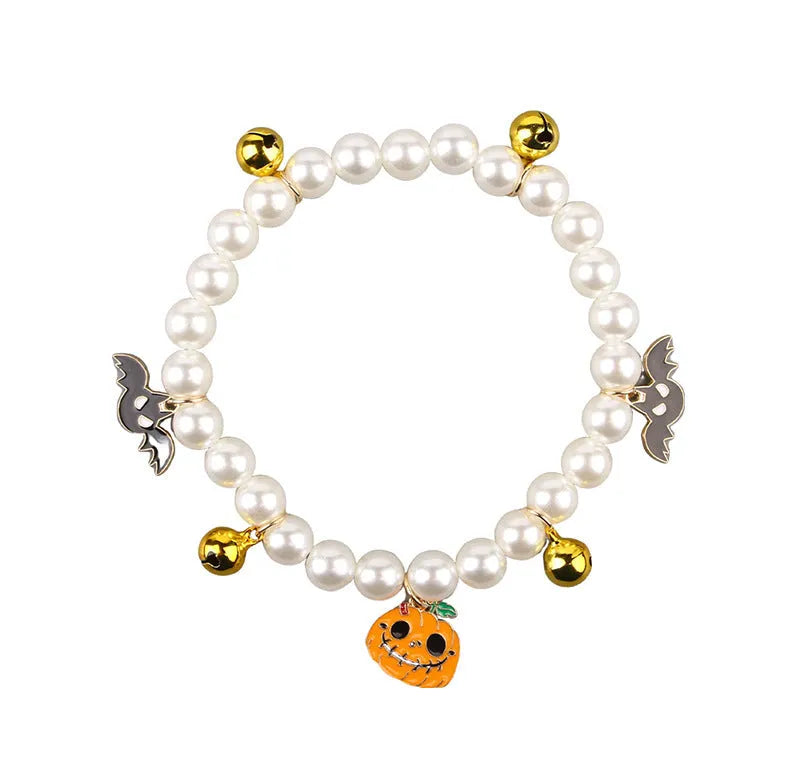 Halloween cat collar with simulated pearl decoration showing purple ghost, skull pumpkin, and smiling pumpkin design options