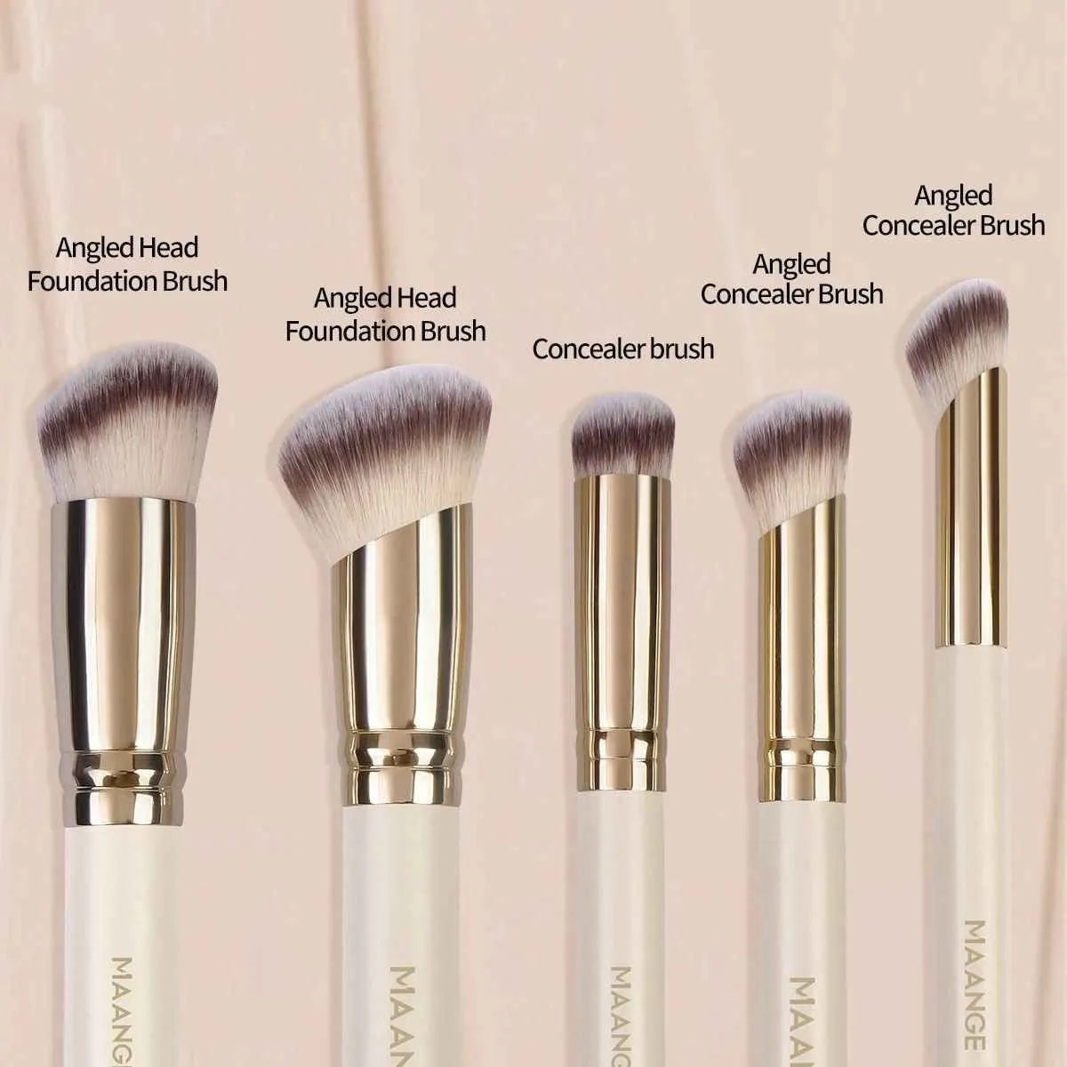 Five apricot coloured makeup brushes including angled blush brush for contouring