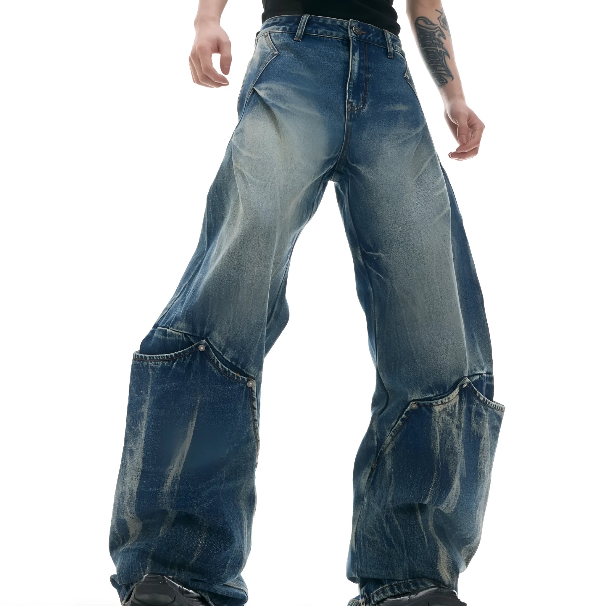 Men's verdant blue jeans with retro washed burst pattern and curved knife design on loose fit trousers