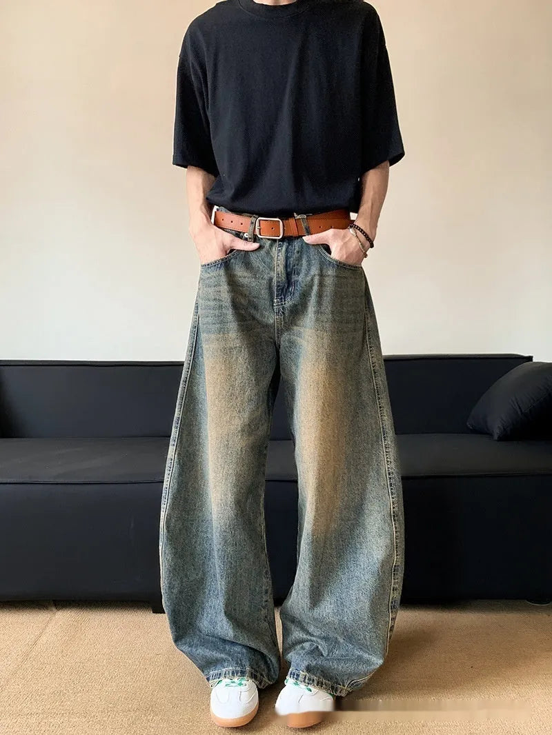 Men's retro blue wide-leg jeans with distressed detailing and machete wash effect