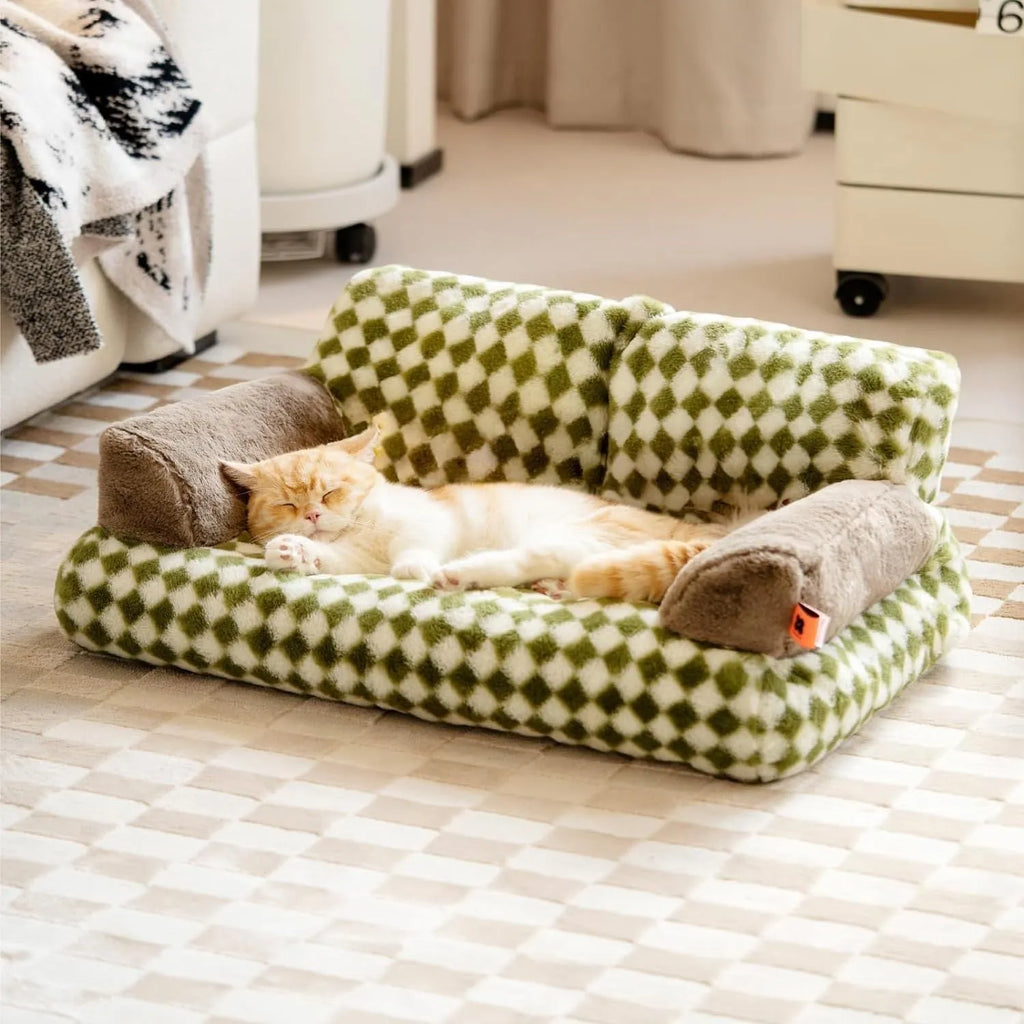 Fluffy cat couch bed in black and white with raised sides and non-slip base for cats and small dogs