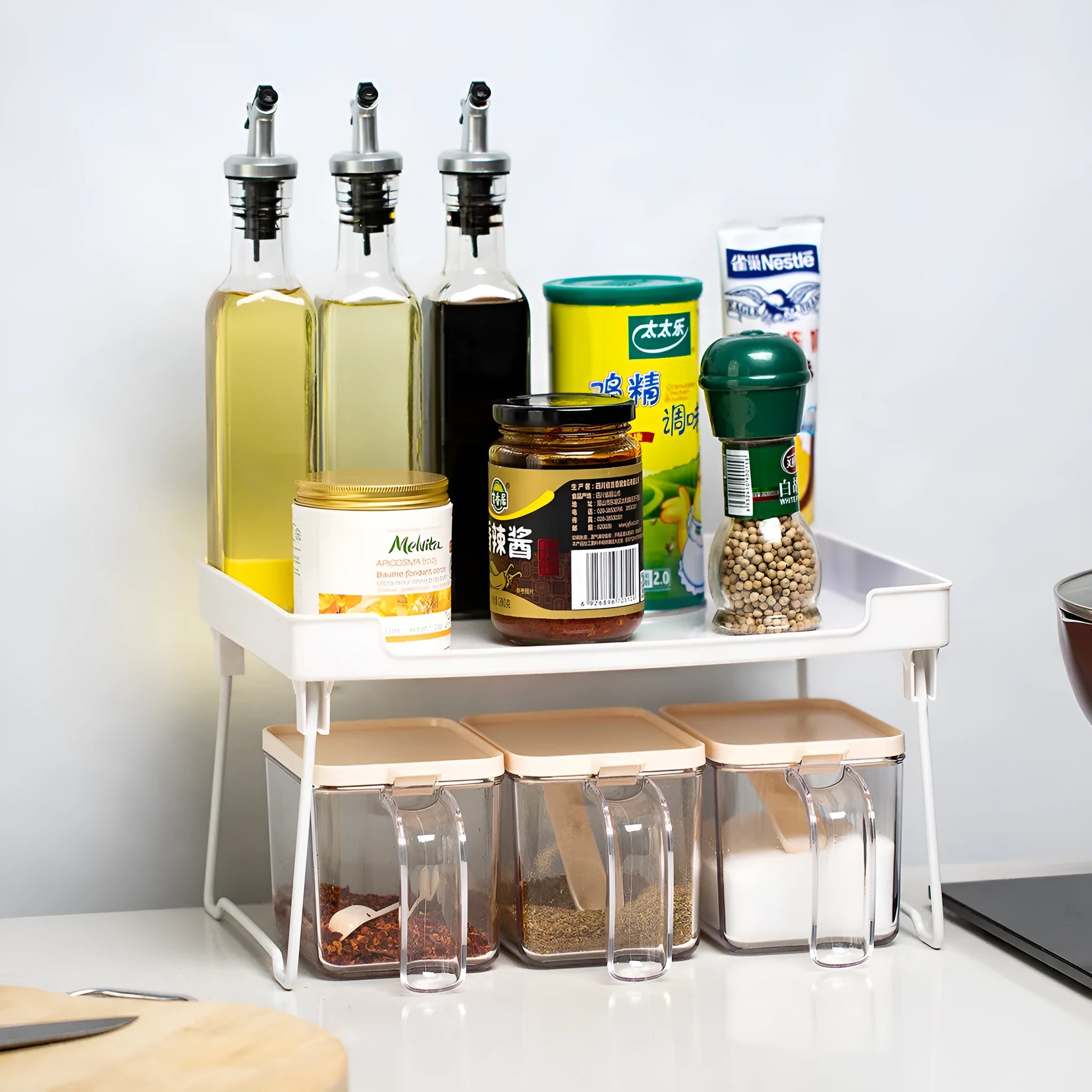 White and transparent plastic kitchen shelf organiser rack for countertop or cupboard storage