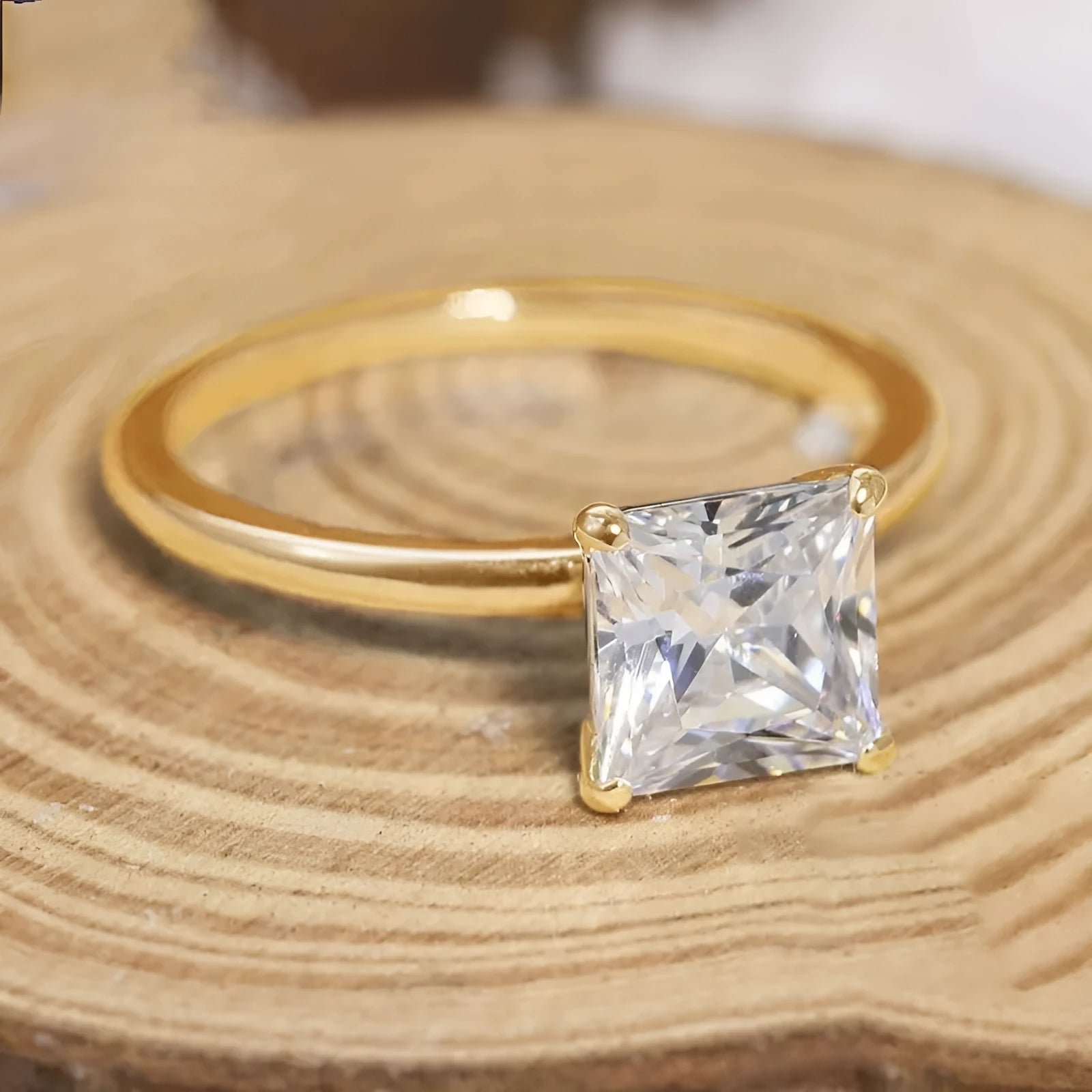 Simple geometric 925 silver ring for women in polished gold, rose gold, or silver finish on a grey background.