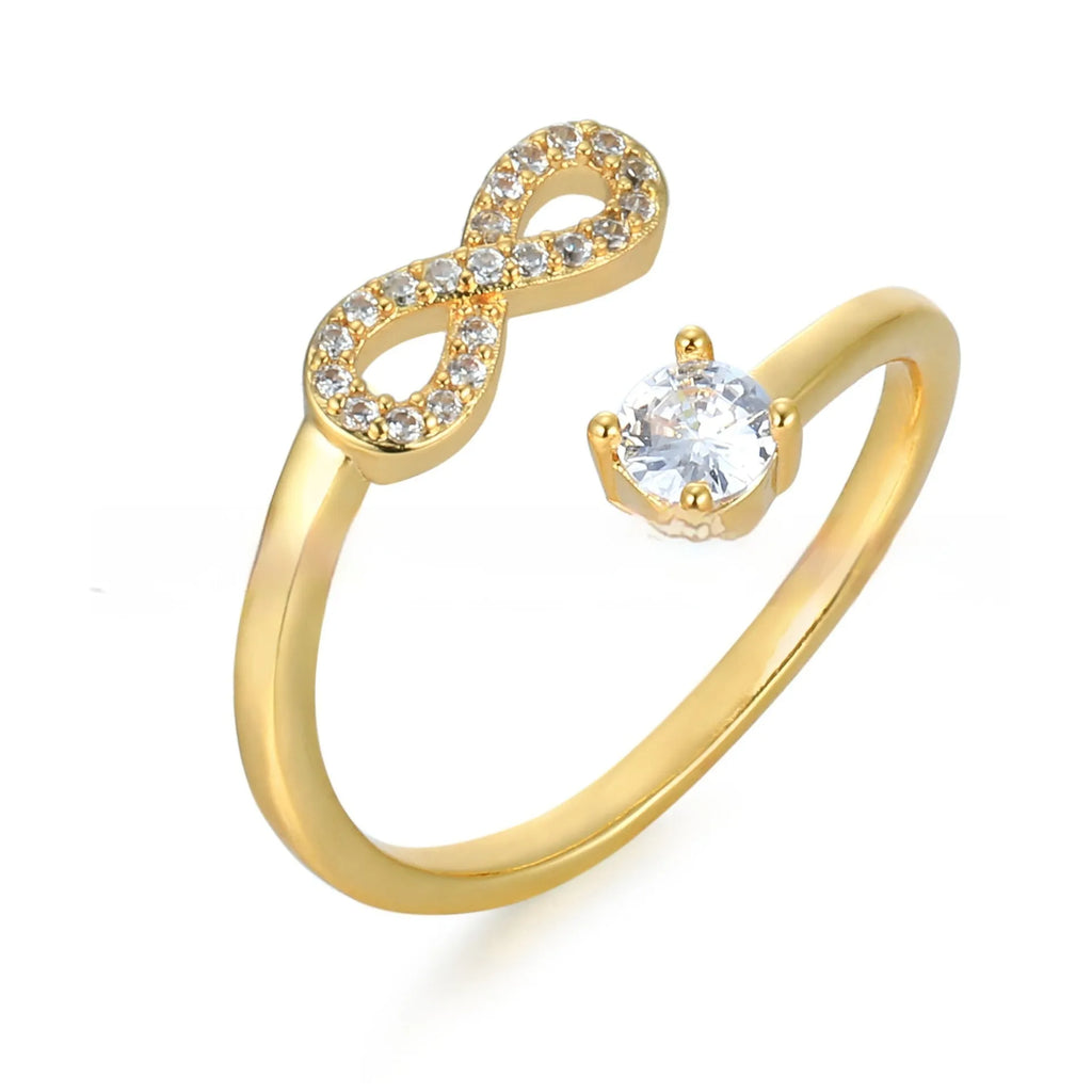 Geometric personality ring with engraved letter and inlaid zircon stones in metallic finish