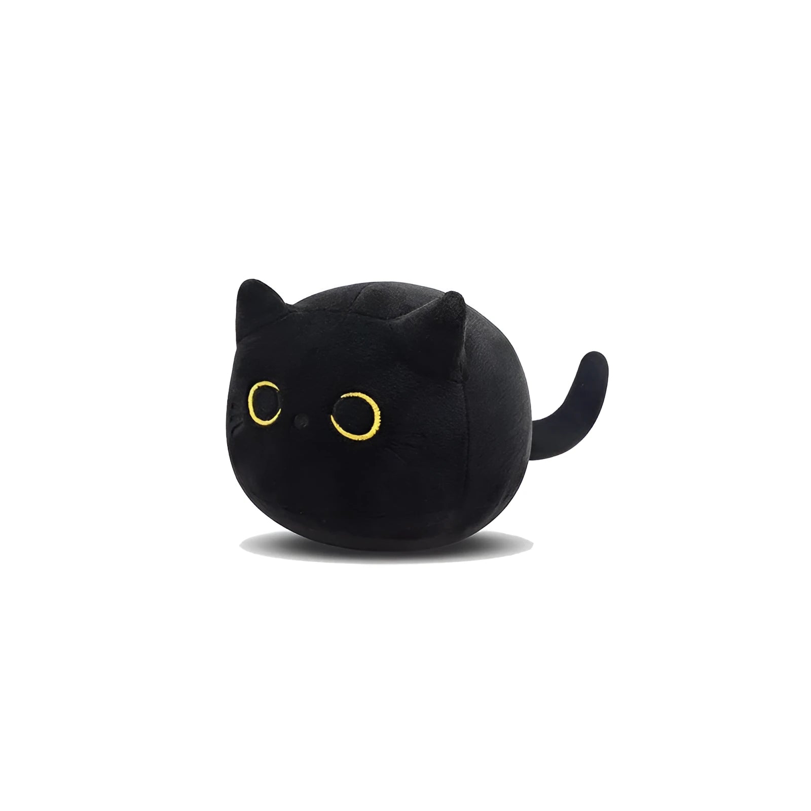 Black cat plush toy stuffed animal sitting as a soft pillow cushion on a sofa.