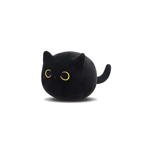 Black cat plush toy stuffed animal sitting as a soft pillow cushion on a sofa.