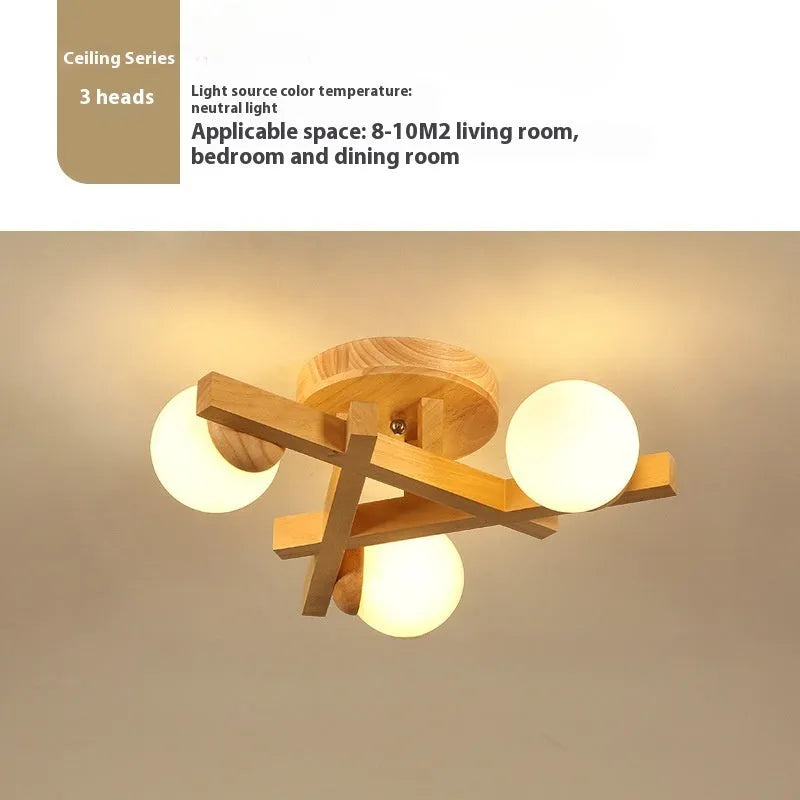 Modern wooden finish ceiling light with three adjustable lamp heads in a neutral white colour.