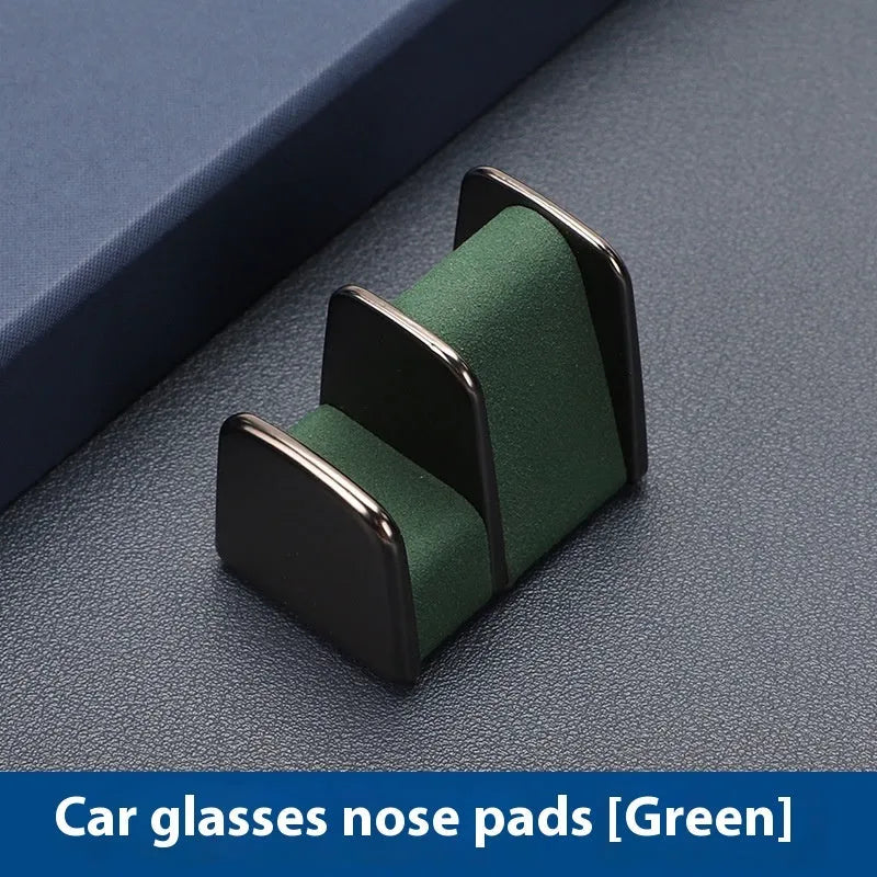 Zinc alloy and leather car dashboard clip for holding glasses in black, grey, green, or red.