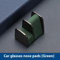 Zinc alloy and leather car dashboard clip for holding glasses in black, grey, green, or red.