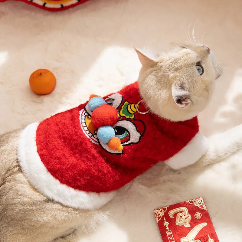 Red pet lion dance sweater with 3D face, colourful pom-poms, and leash ring on small dog