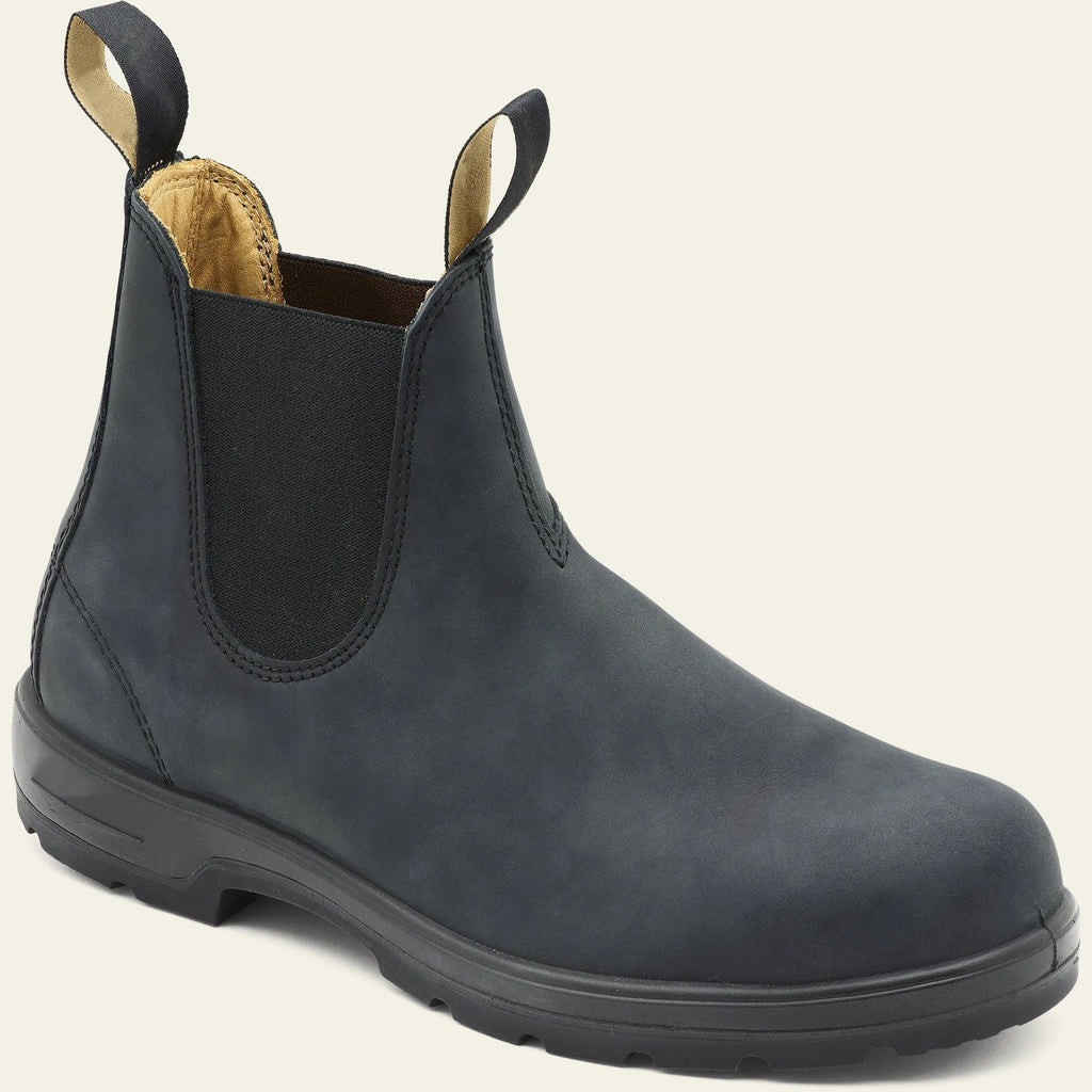 Vintage frosted brown PU leather Chelsea boots for men and women on a wooden surface.