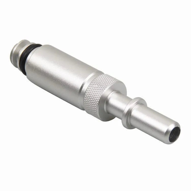Silver metal transmission refuelling joint for VAS6262-9 tool on a workshop bench.