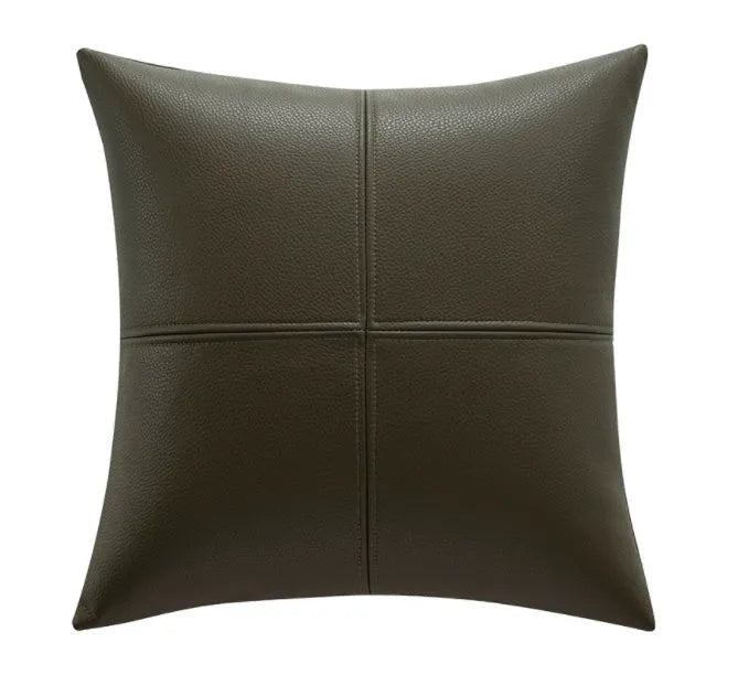 Simple solid colour soft cowhide leather pillow cover on a sofa in a nordic style room.