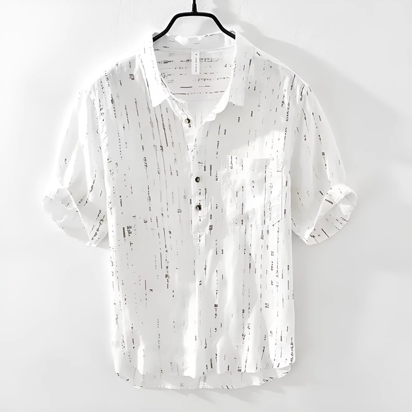 Men's loose fit black and white short sleeve polo shirt on a hanger