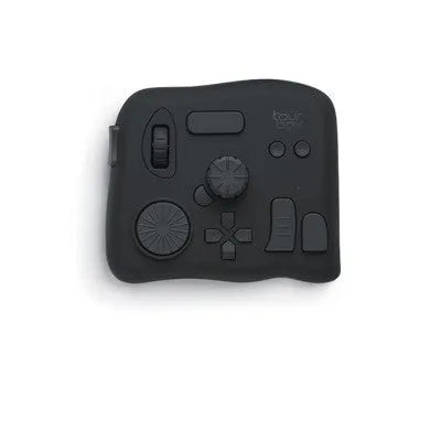 TourBox NEO programmable auxiliary keyboard for video editing and digital creation on a desktop.