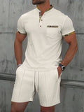 Men's grey waffle texture zipper polo collar short sleeve jacket and matching shorts set on a hanger.