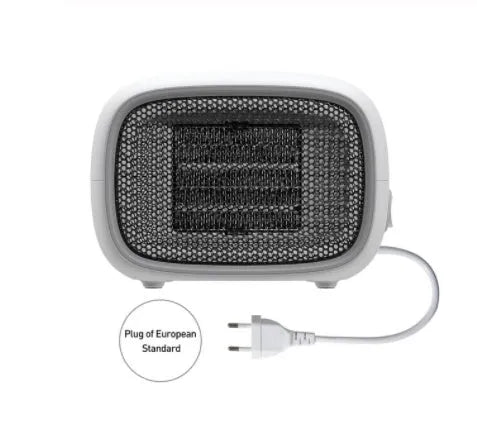 Green mini PTC ceramic fan heater showing compact size and metal mesh front grille.