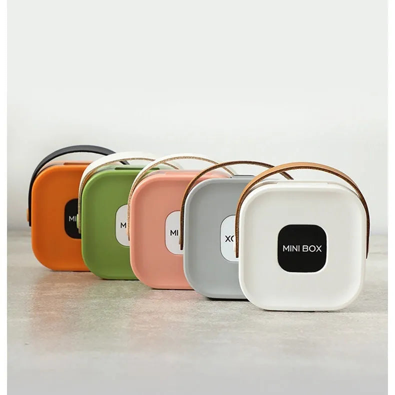 Medium solid colour polypropylene storage box for organising cables, shown in Nordic White.