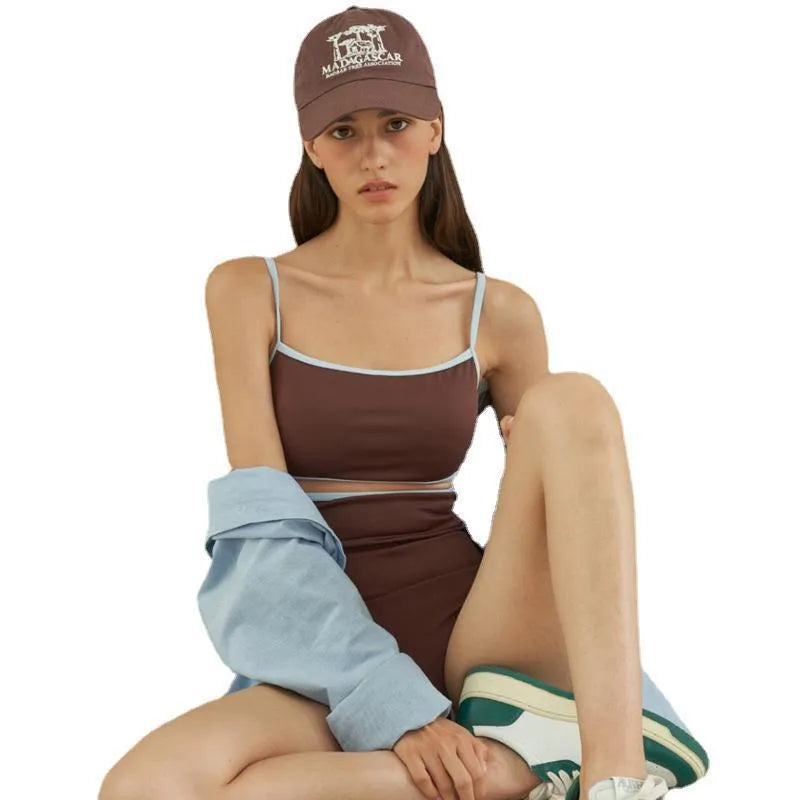 Brown women's one-piece triangle top swimsuit on hanger