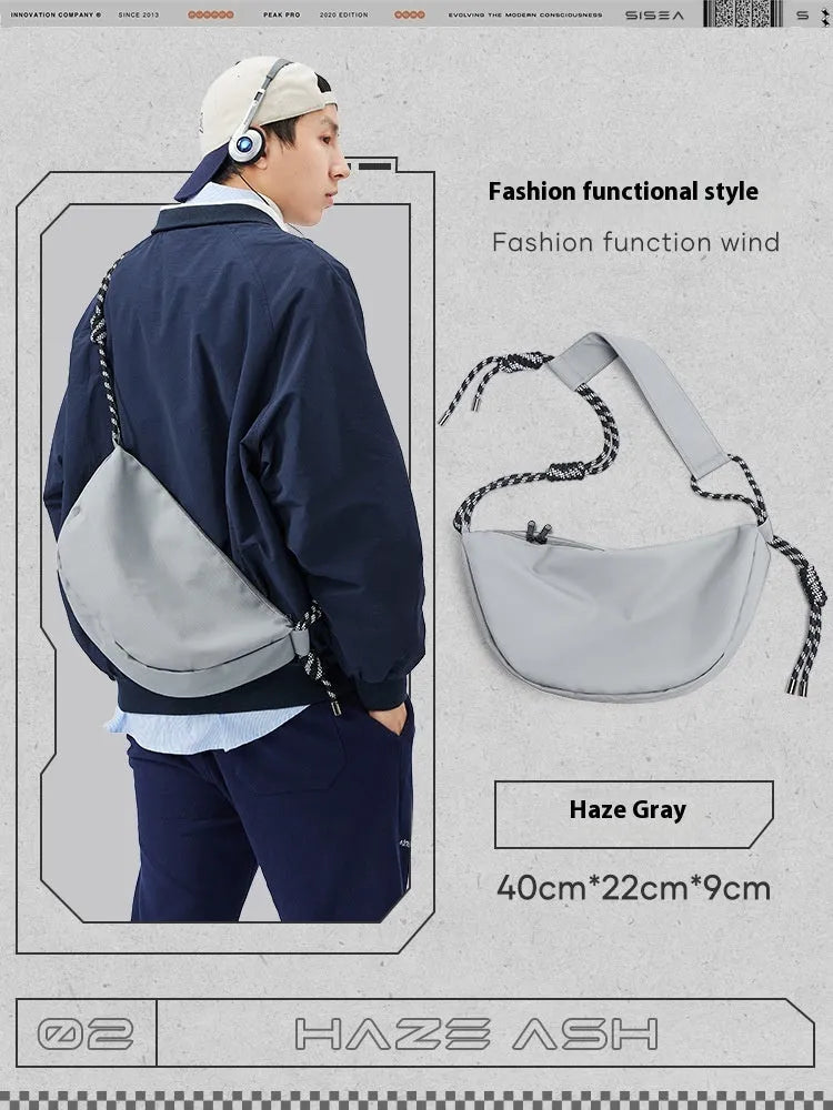 Men's lightweight nylon messenger bag in a choice of colours showing large capacity design.