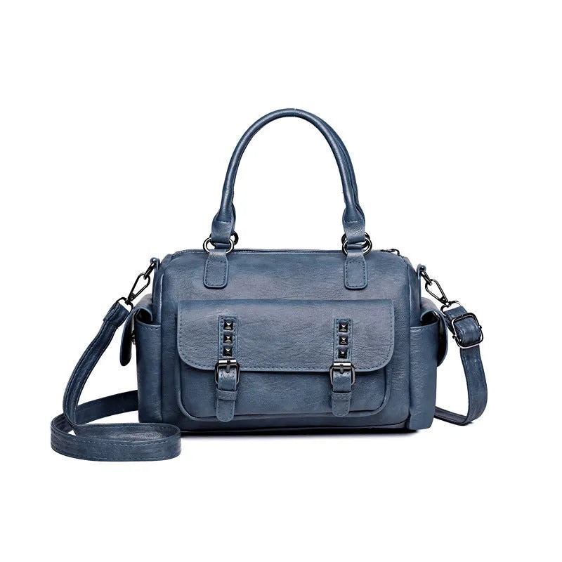 Vintage-style large square messenger bag in PU leather with contrast stitching.