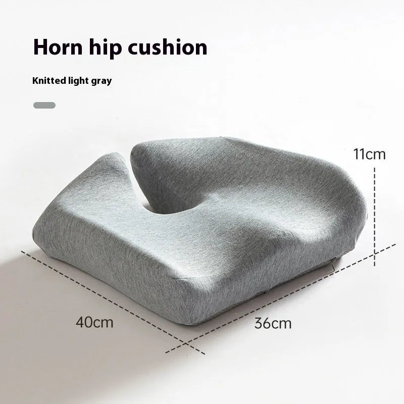 Black memory foam office chair cushion with a solid colour polyester cover, shown on a chair seat.