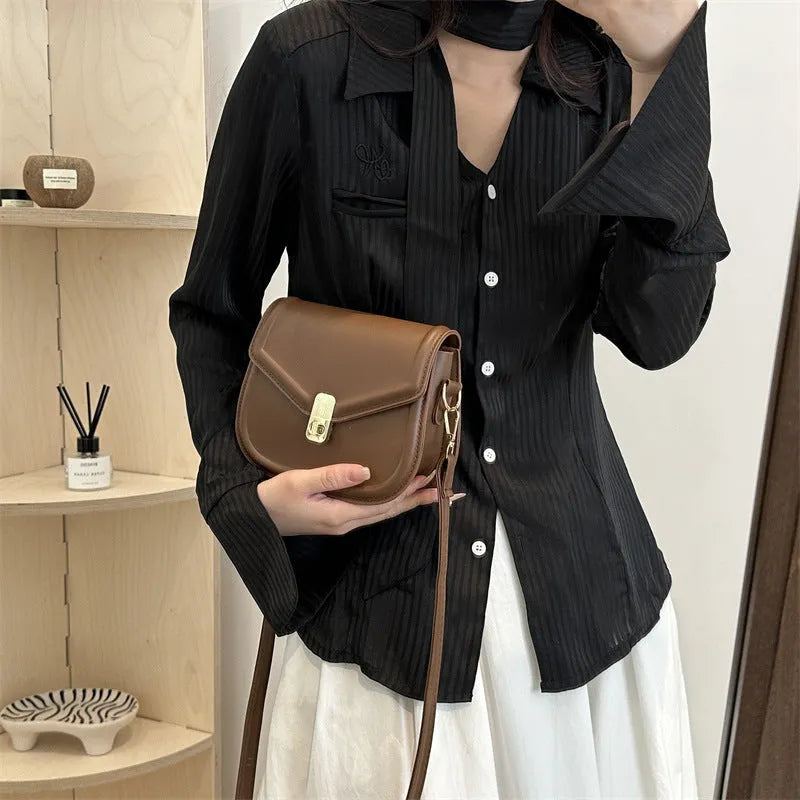 Niche texture shoulder messenger bag in soft PU leather with clamshell opening and horizontal square shape