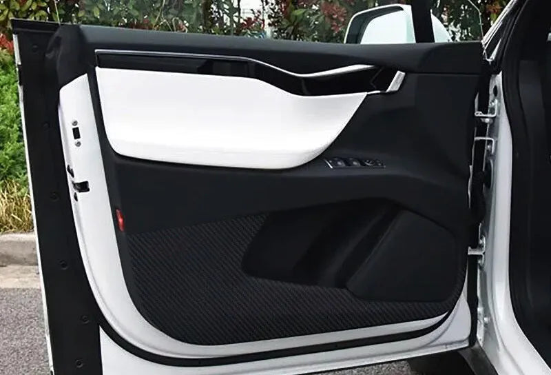 Tesla Model S door protective film package showing four transparent carbon fibre sheets for interior door panel protection