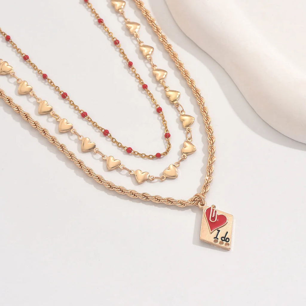 Geometric heart pendant on an adjustable three-layer zinc alloy clavicle chain necklace.