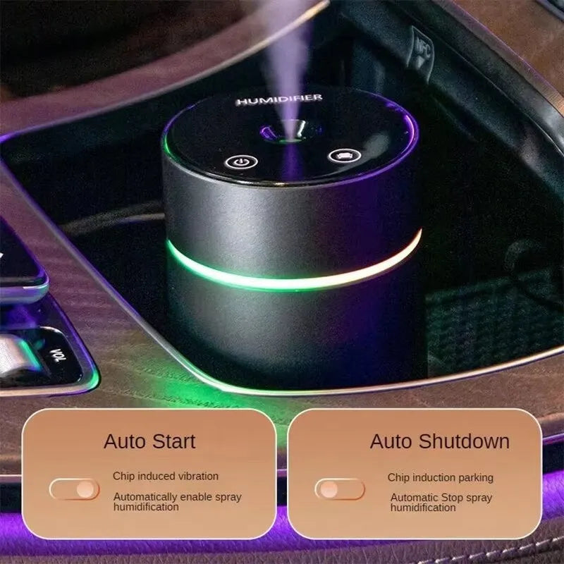 Aluminium portable car humidifier and essential oil diffuser with night light on a black USB cable.