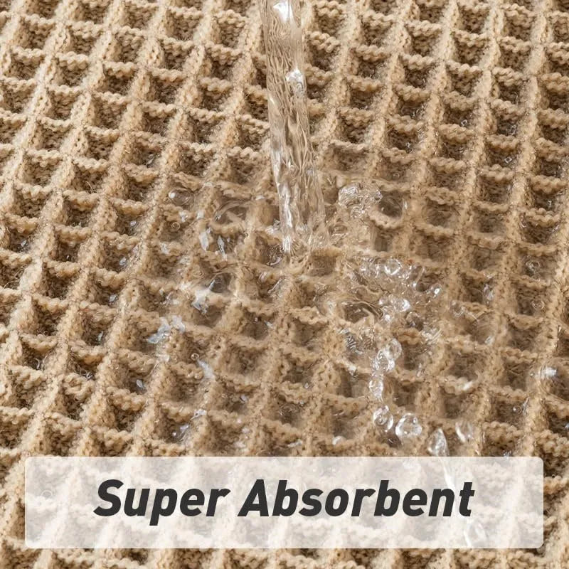 A square, checkered-pattern absorbent bathroom floor mat with a non-slip backing, shown in a neutral colour.