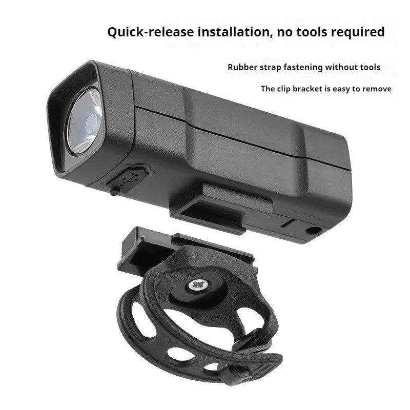Black USB rechargeable bicycle headlight with quick-release strap mount on handlebars
