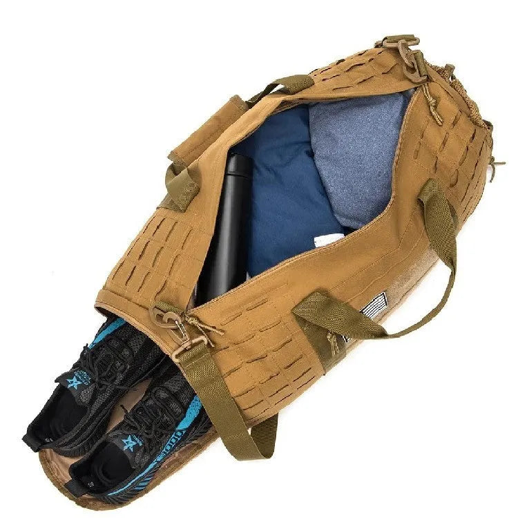 Large khaki men's waterproof sports duffel bag with air cushion shoulder strap, shown next to gym equipment.