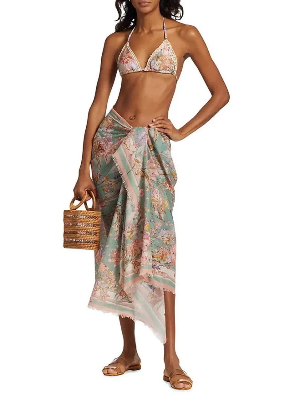 Women's floral bikini swimsuit set with skirt in creamy-white colour, showing top, briefs, and cover-up components