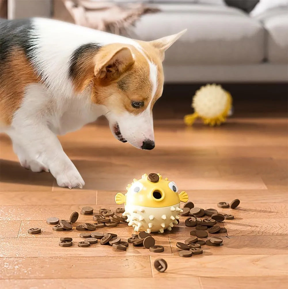 Green fish-shaped interactive dog toy with treat dispensing opening and textured surface for medium and large dogs