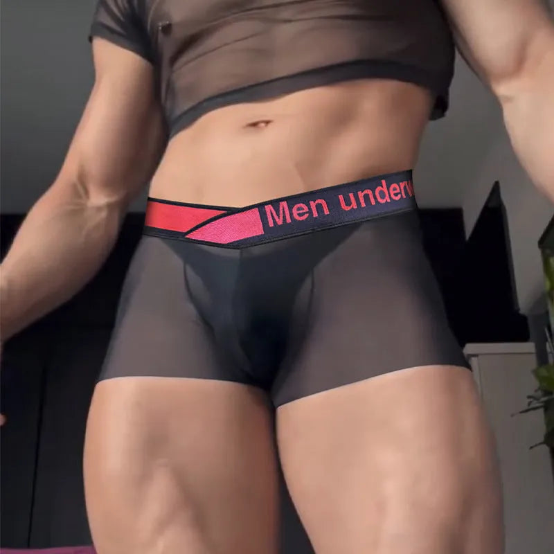 Men's low waist laser gradient underwear in black, red, and white colours with seamless construction