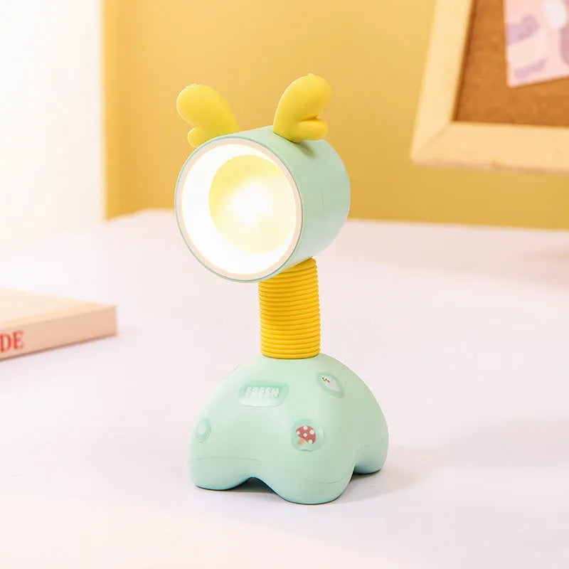 DIY cartoon animal small night lamp with magnetic base in assorted colours on a desk.