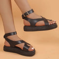 Women's white thick-soled Roman lace buckle sandals on a neutral background