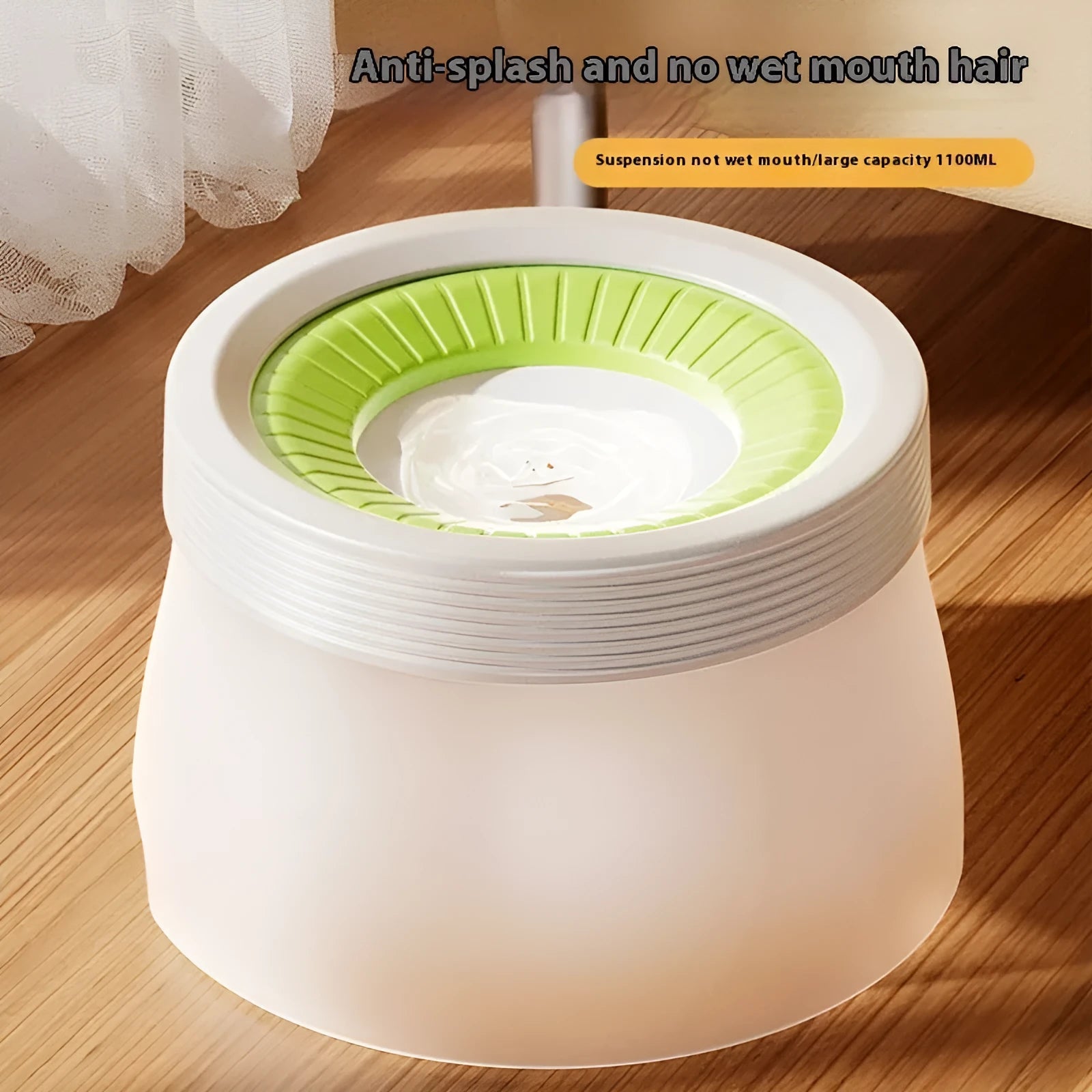 Green suspended pet water bowl for medium and small dogs and cats on a white plate