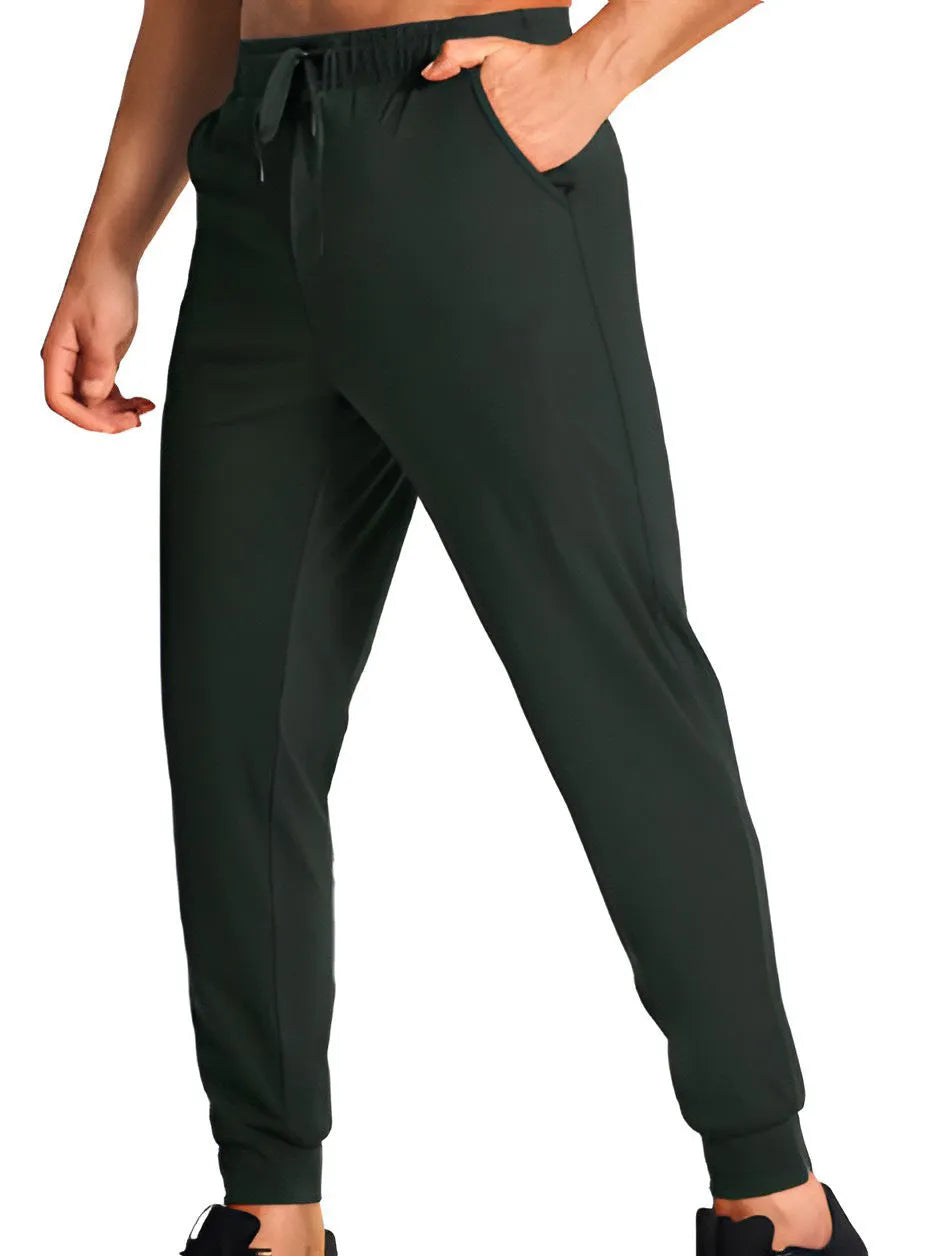 Men's solid colour loose casual trousers in polyester fabric on a hanger.