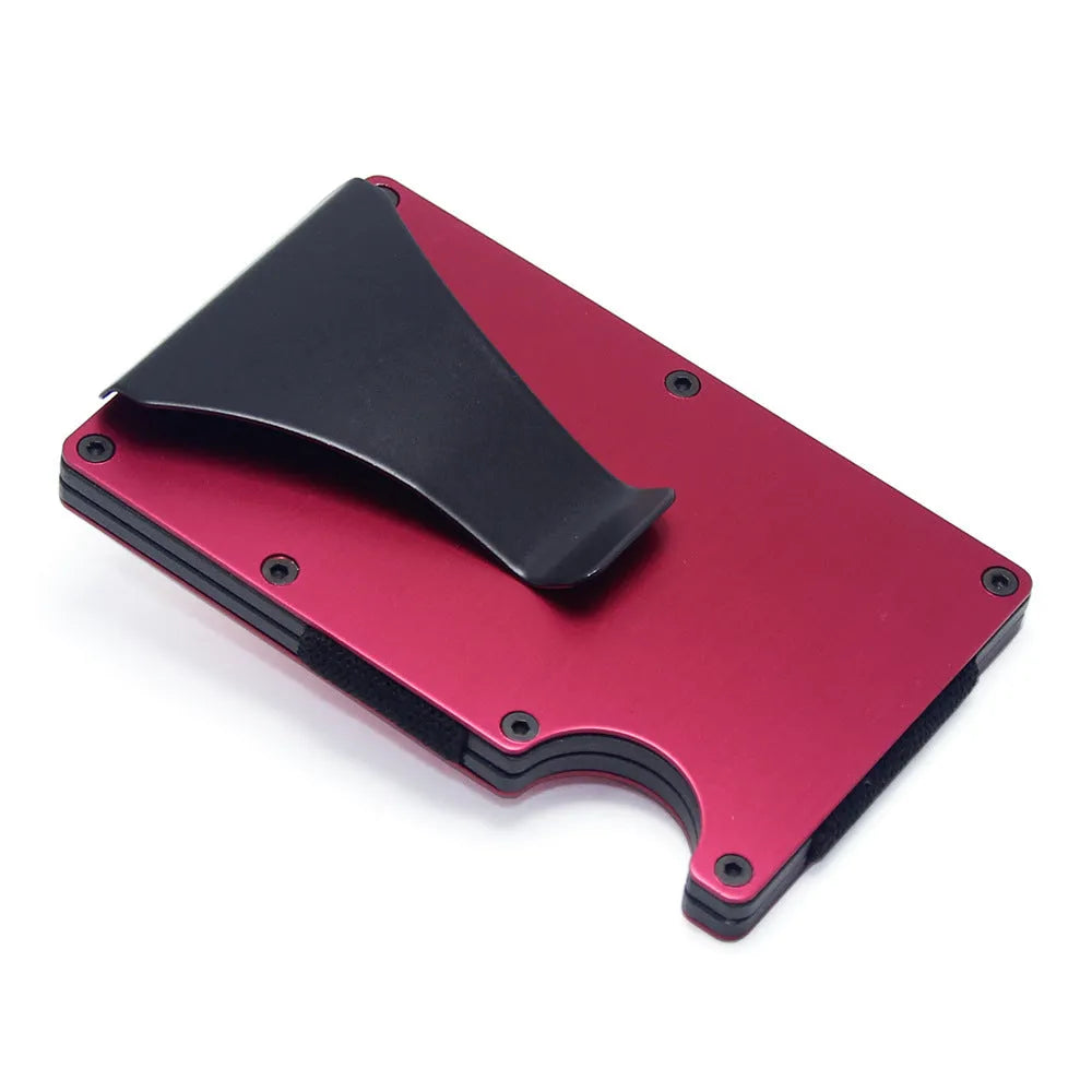 Slim black carbon fibre card holder wallet with geometric design on a table.