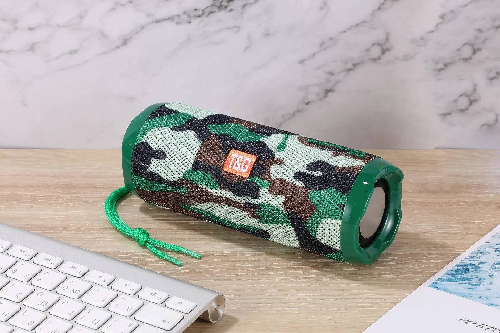 Blue portable Bluetooth speaker with a fabric card holder on the front
