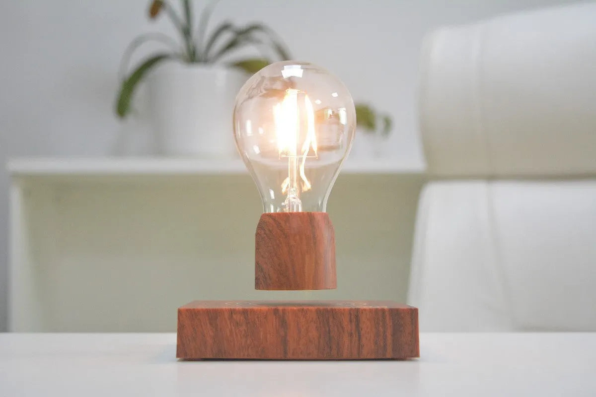 Magnetic levitation floating bulb lamp with imitation wood base and glass construction