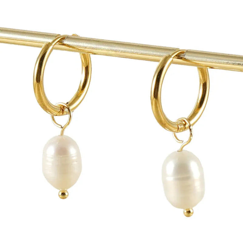 Gold geometric stainless steel earrings with pearl decorative elements and titanium posts