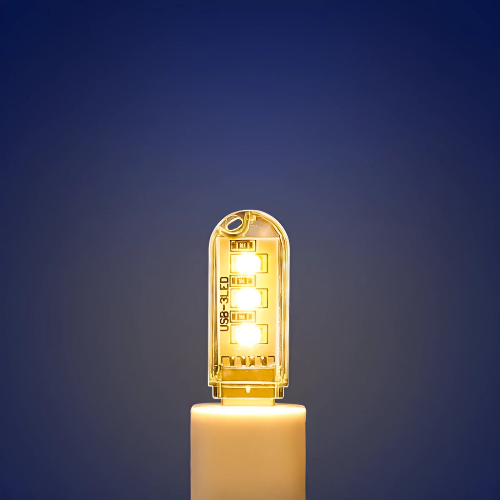 Small round USB baby night light showing warm and white light colour options