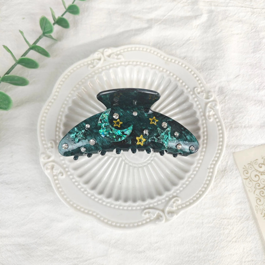 Oversized women's hair barrette with a starry sky pattern in sky blue.