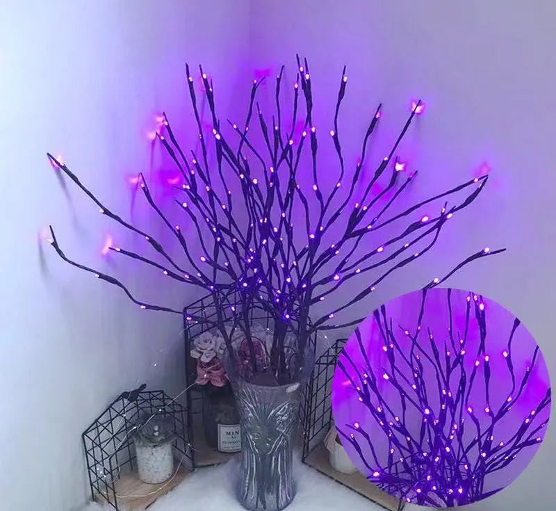 LED decorative tree light in a vase with silver branches illuminated in a choice of six colours.