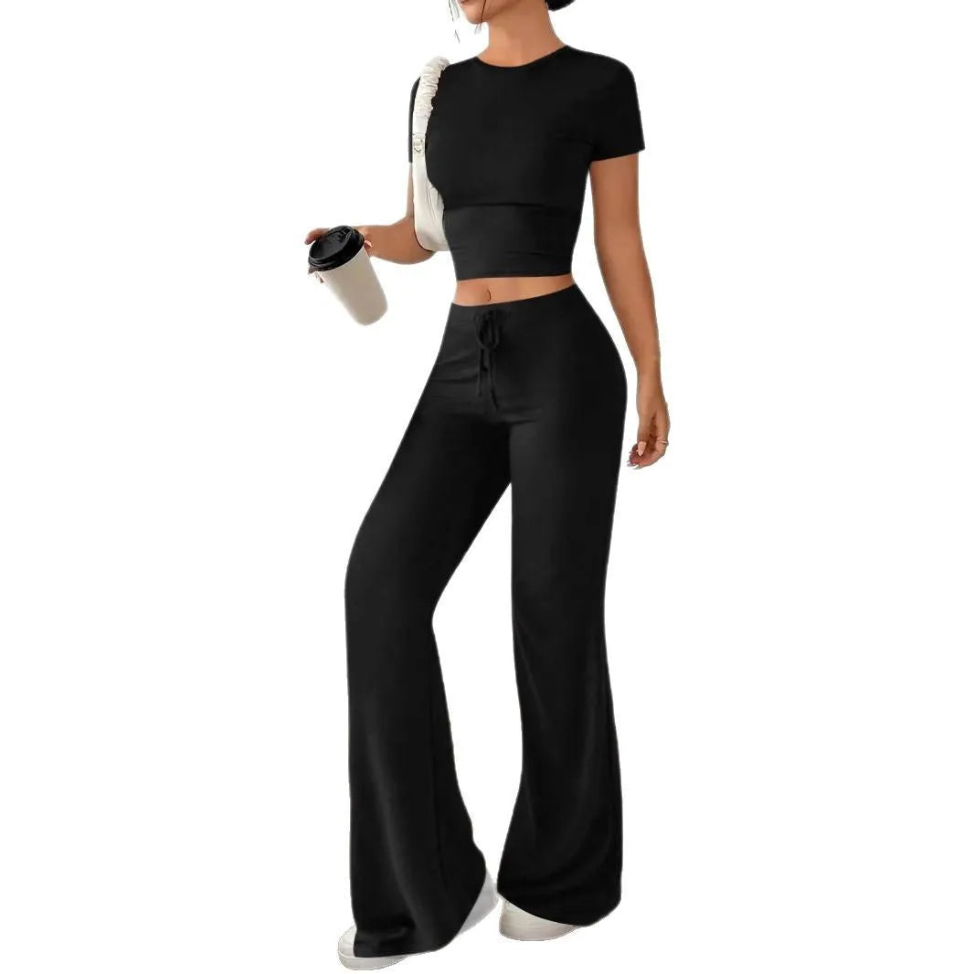 Black women's co-ord suit with high-waist trousers and a short-sleeve T-shirt on a hanger.